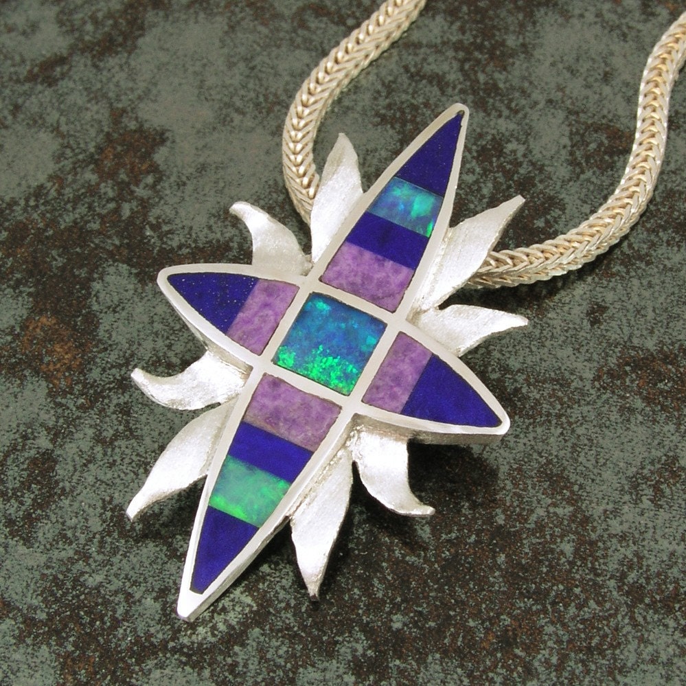 Starburst sterling silver pendant inlaid with lapis, opal and sugilite