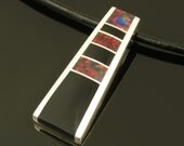 Sterling silver pendant inlaid with lab created opal and black onyx