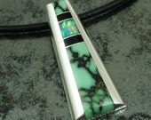 Sterling silver pendant by Mark Hileman inlaid with black onyx, Australian opal and chalcosiderite.