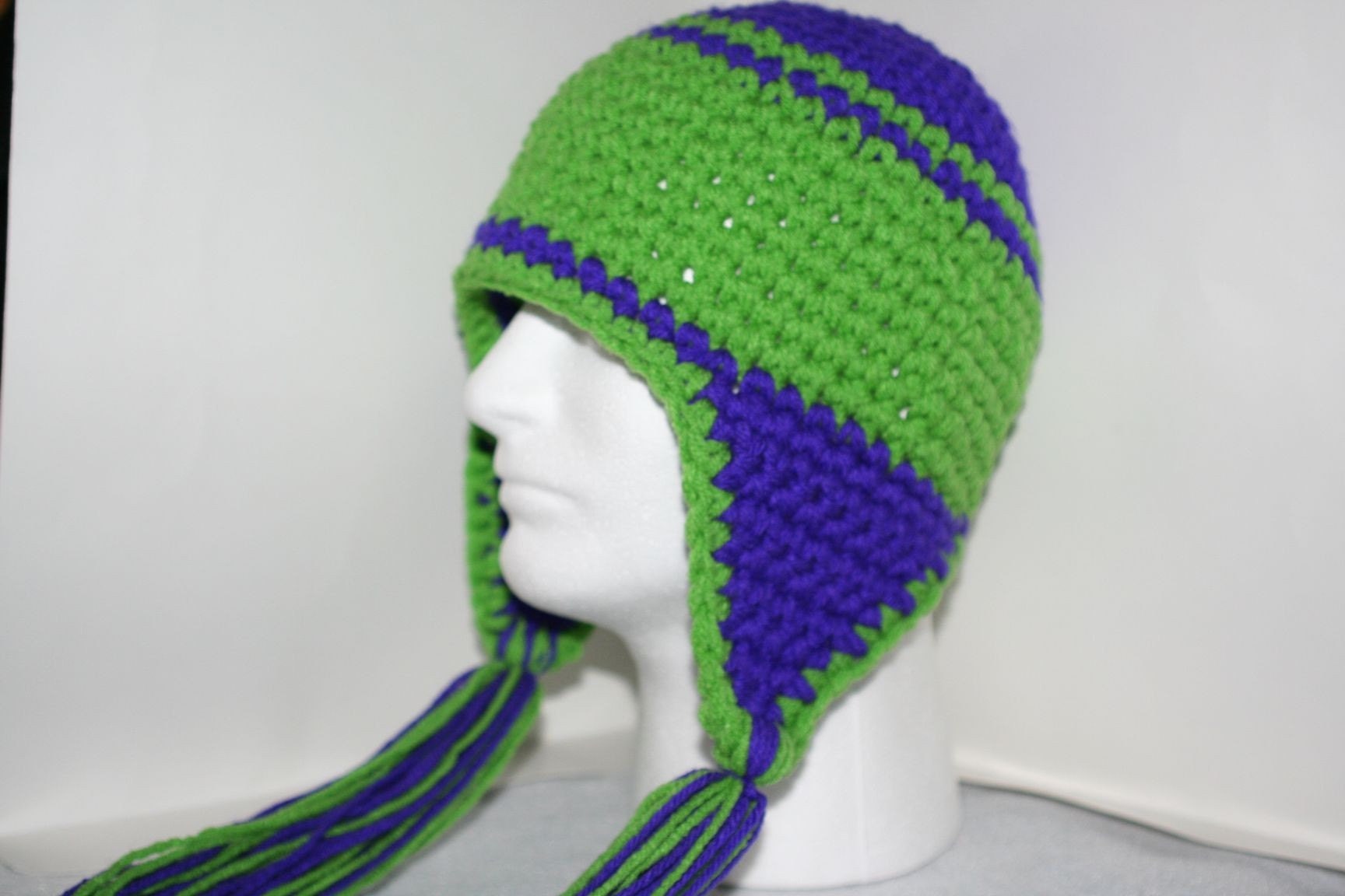 Adult size unique handmade lime green and purple striped winter hat with matching tassels and ear flaps