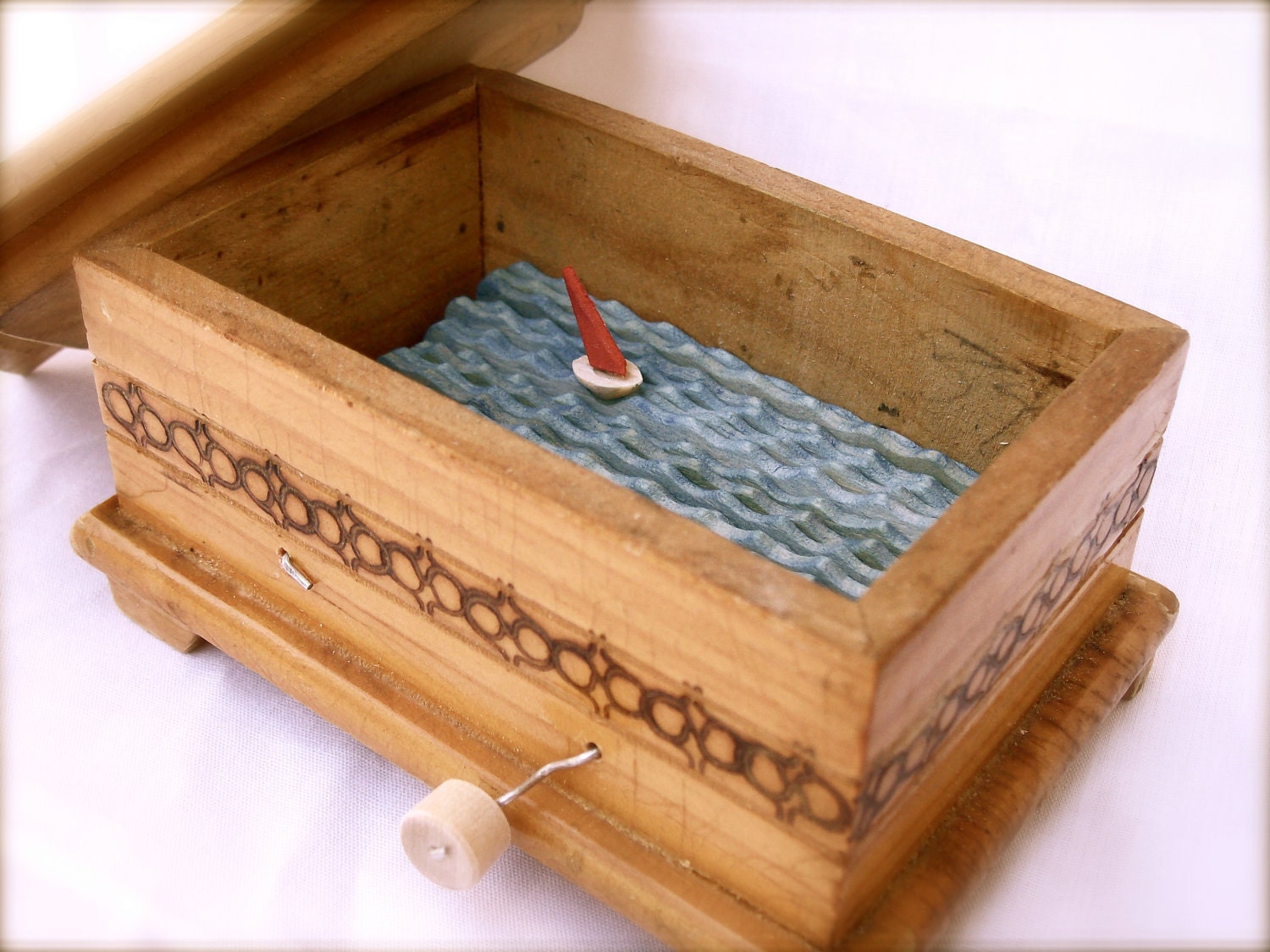 sailboat automaton in lidded wooden box