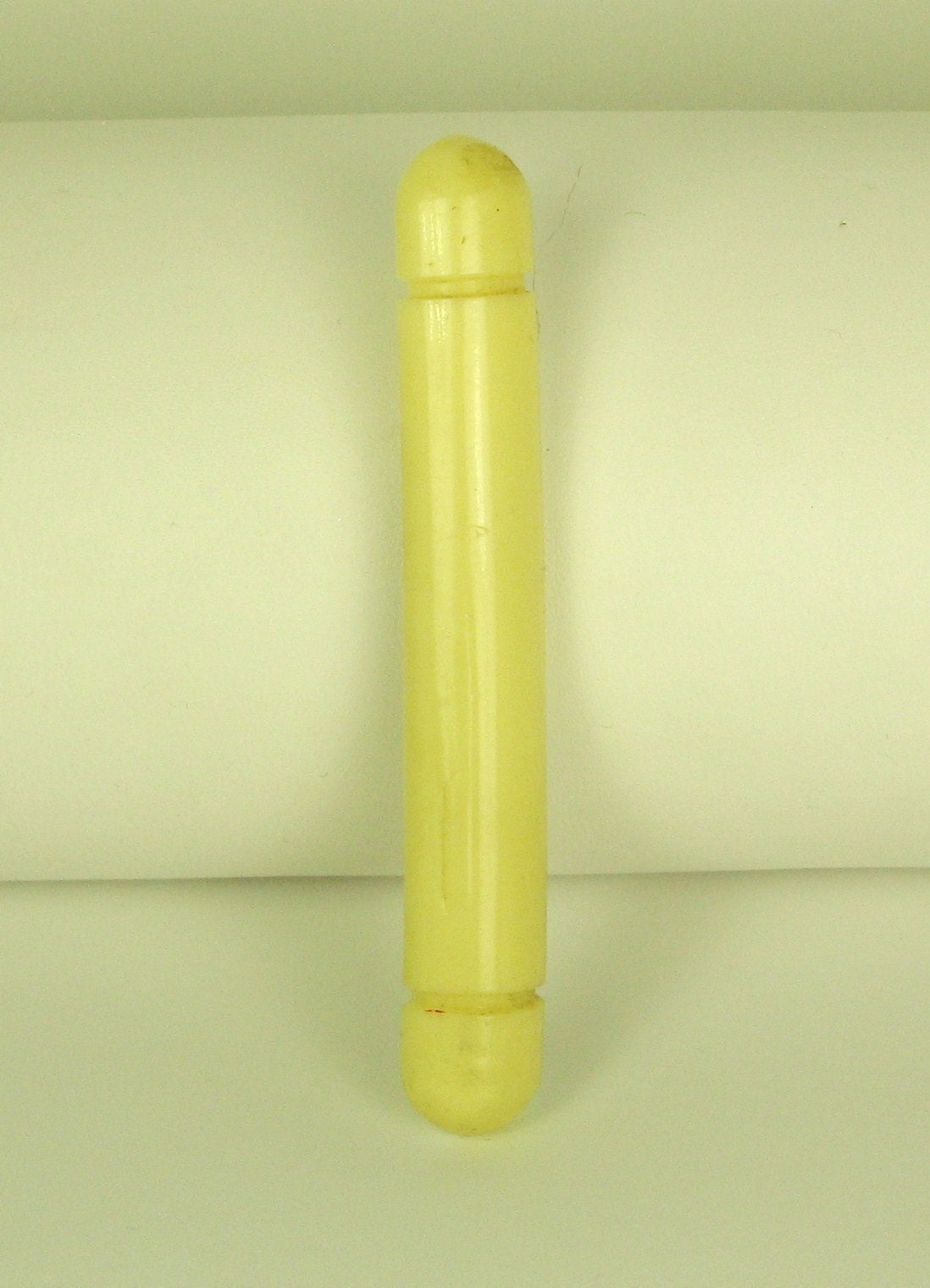 Cream Colored Plastic Cylinder Pin