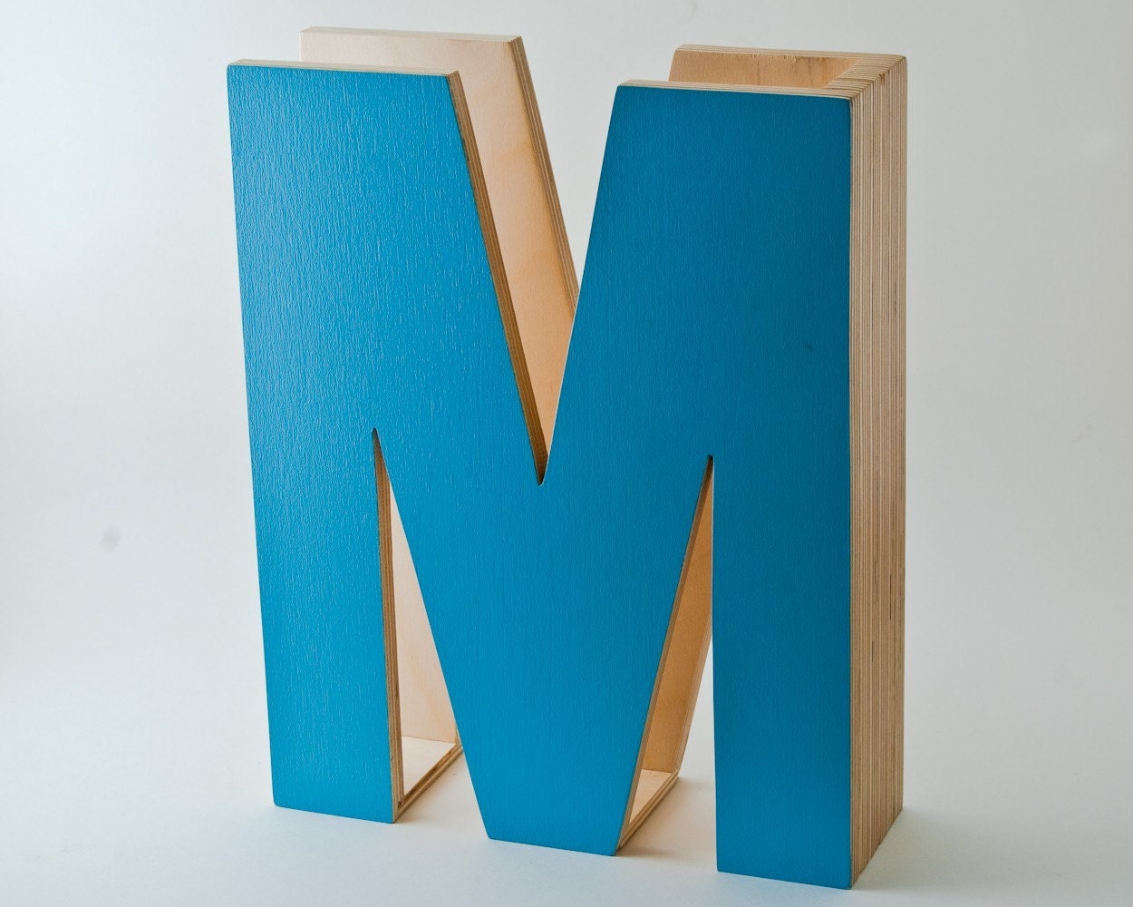 M is for magazine. in turquoise.