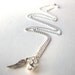 Miscarriage necklace, silver angel wing and tinkling bell charms on silverplated chain infant loss remembrance