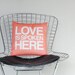 Love is Spoken Here 14"x14" pillow in coral pink