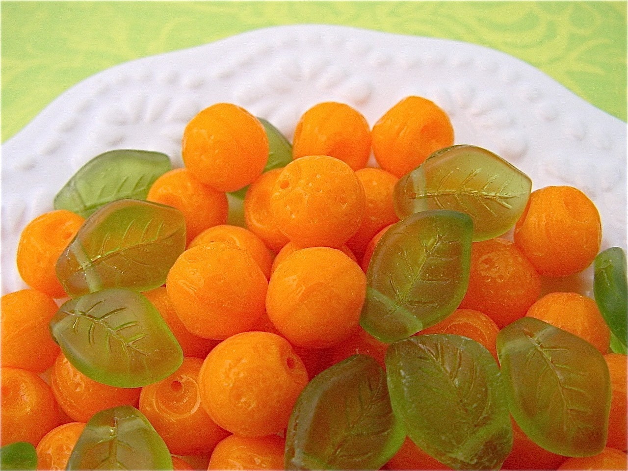 Tangerine oranges leaves glass beads