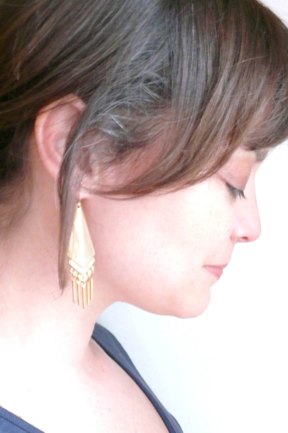Tribal geometric earrings with vintage brass fringe. Gold triangles on 14K gold fill ear wires.