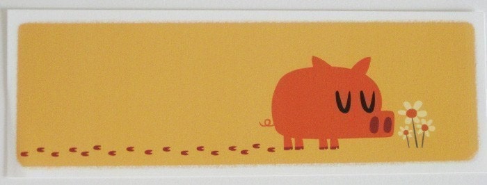 Pig smelling flowers