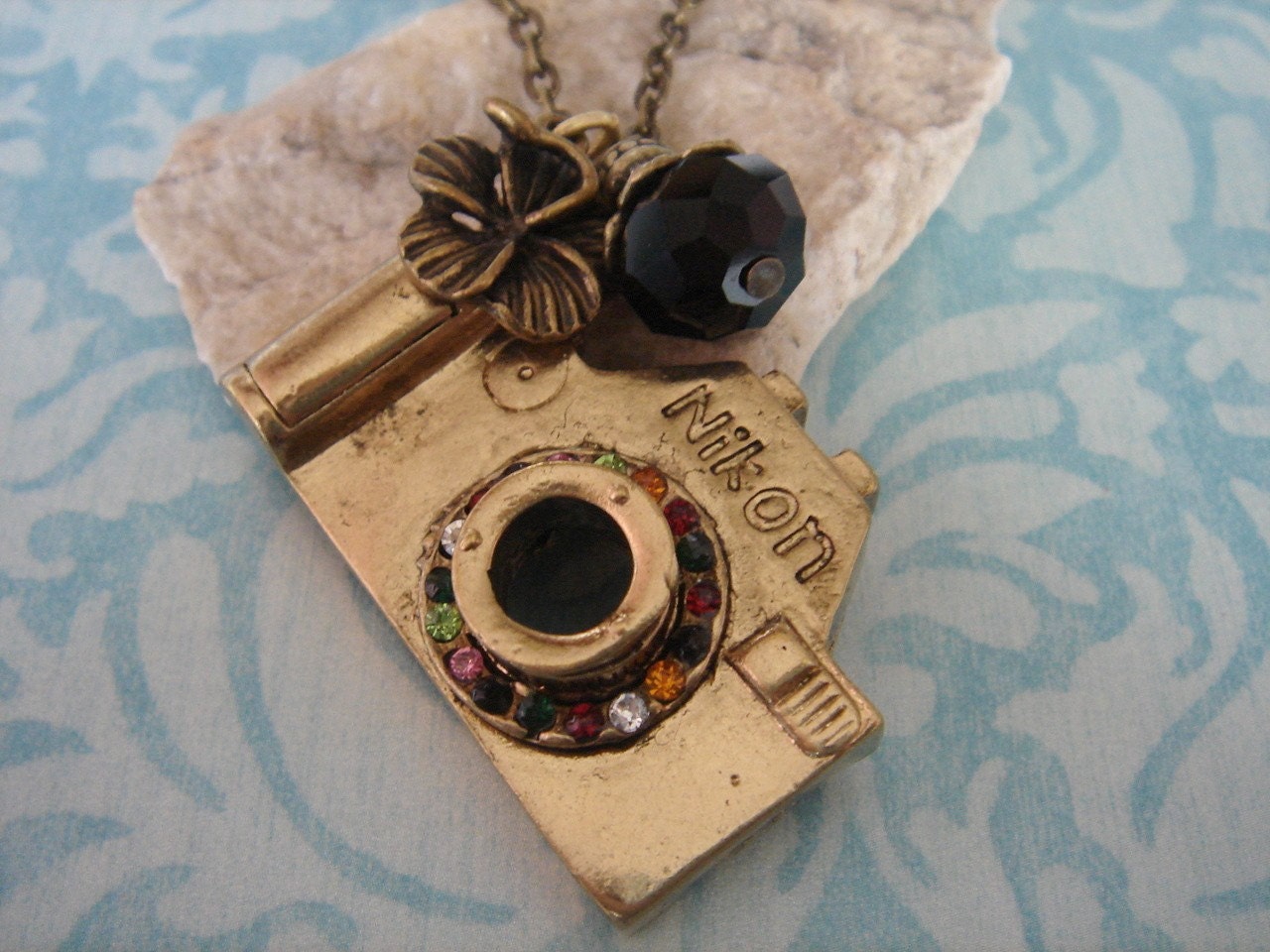 Picture Perfect. Camera necklace with flower charm (Antique tone)