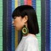 The Coco woven hoop earrings in spring green / black