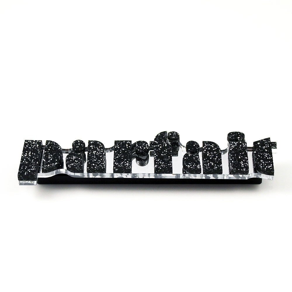 The Parfait black glitter brooch