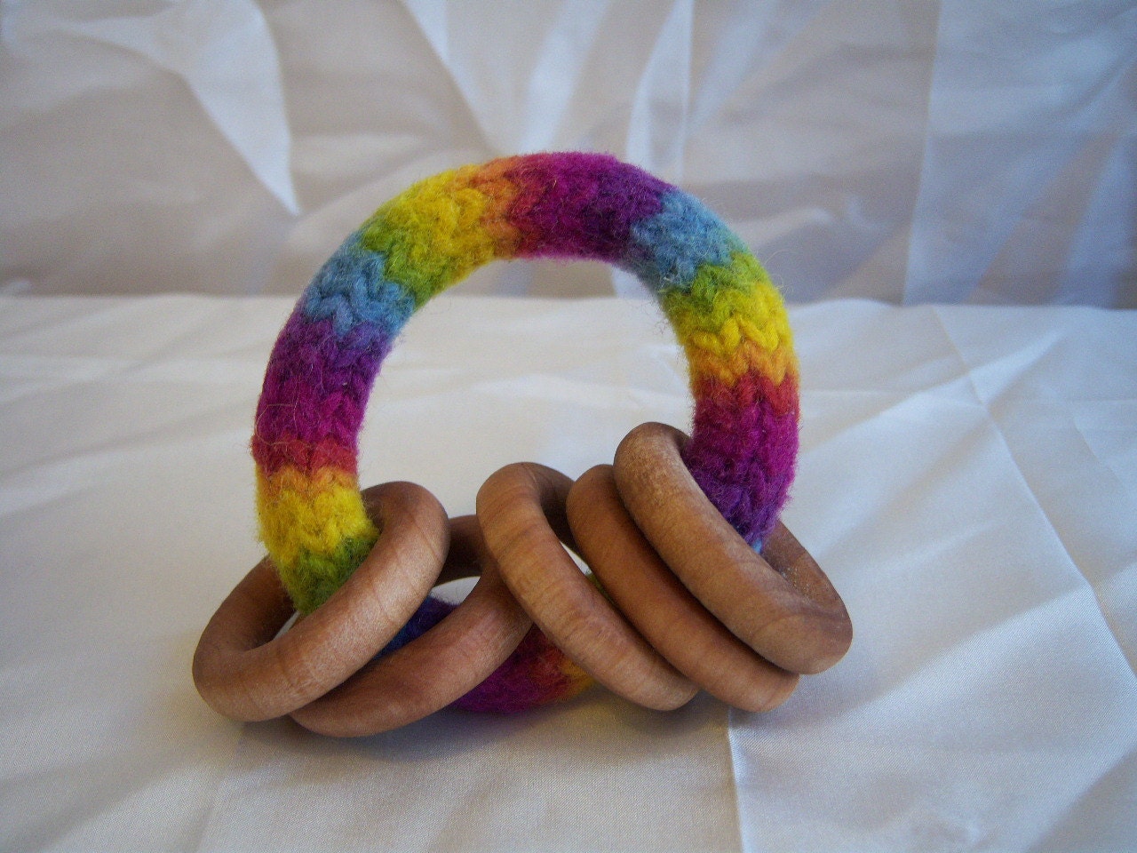 Waldorf Baby Toy - Maple Wood Rattle Teething Ring - Felted Wool Ring in Plant Dyed Bright Rainbow Wool Yarn