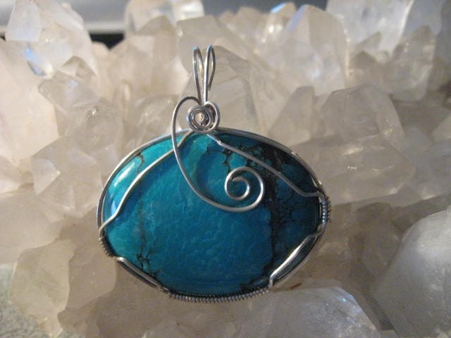 Beautiful torquoise pendant wrapped in sterling silver