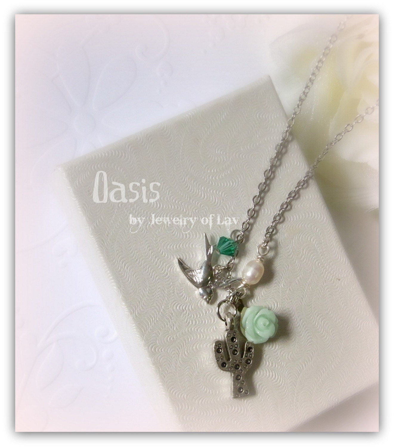 Oasis made with cactus charm, bird charm, green rose, swarovski crystal, fresh water pearl etc.