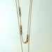 Triple quartz cluster on vintage brass chain
