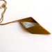 geometric brass rhombus with crystal point necklace