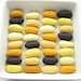 32 felted wool pebbles (dark gray and yellow shades)