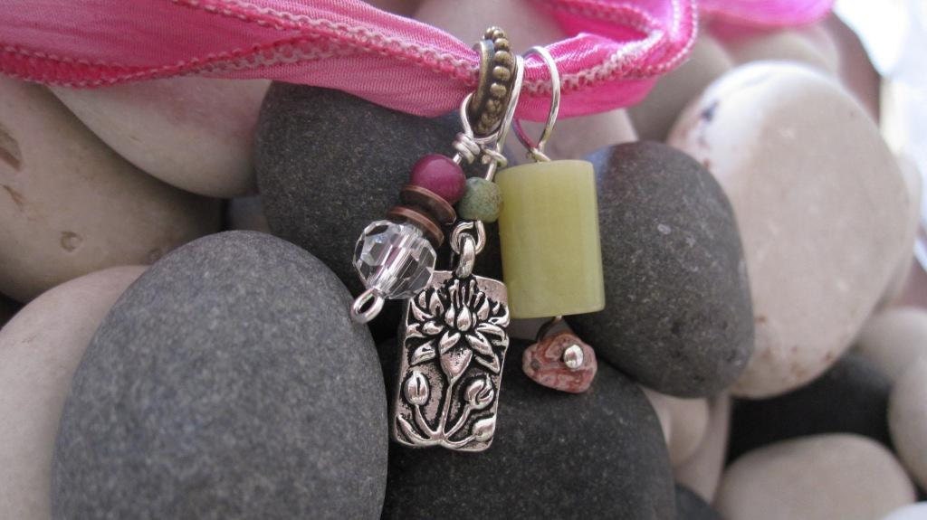 Silk wrap tie bracelet with charms in hot pink and lime green