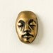 Face Cabochon in Black and Metallic Bronze