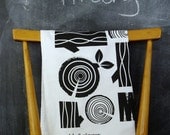 logpile tea towel in black on white