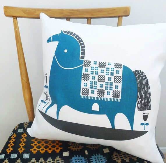 rocking horse cushion in teal on white linen