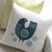 Daisy bird cushion in teal on white linen