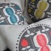 Pomegranate tree cushion in red on natural linen
