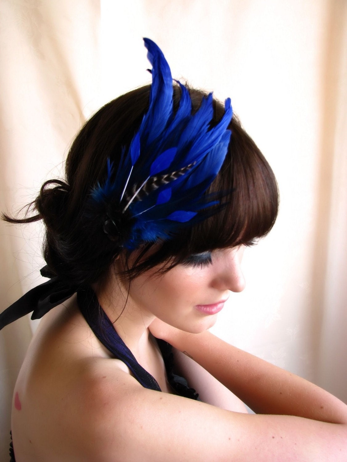 feather hair piece headdress with striped feather coque and crystal on headband