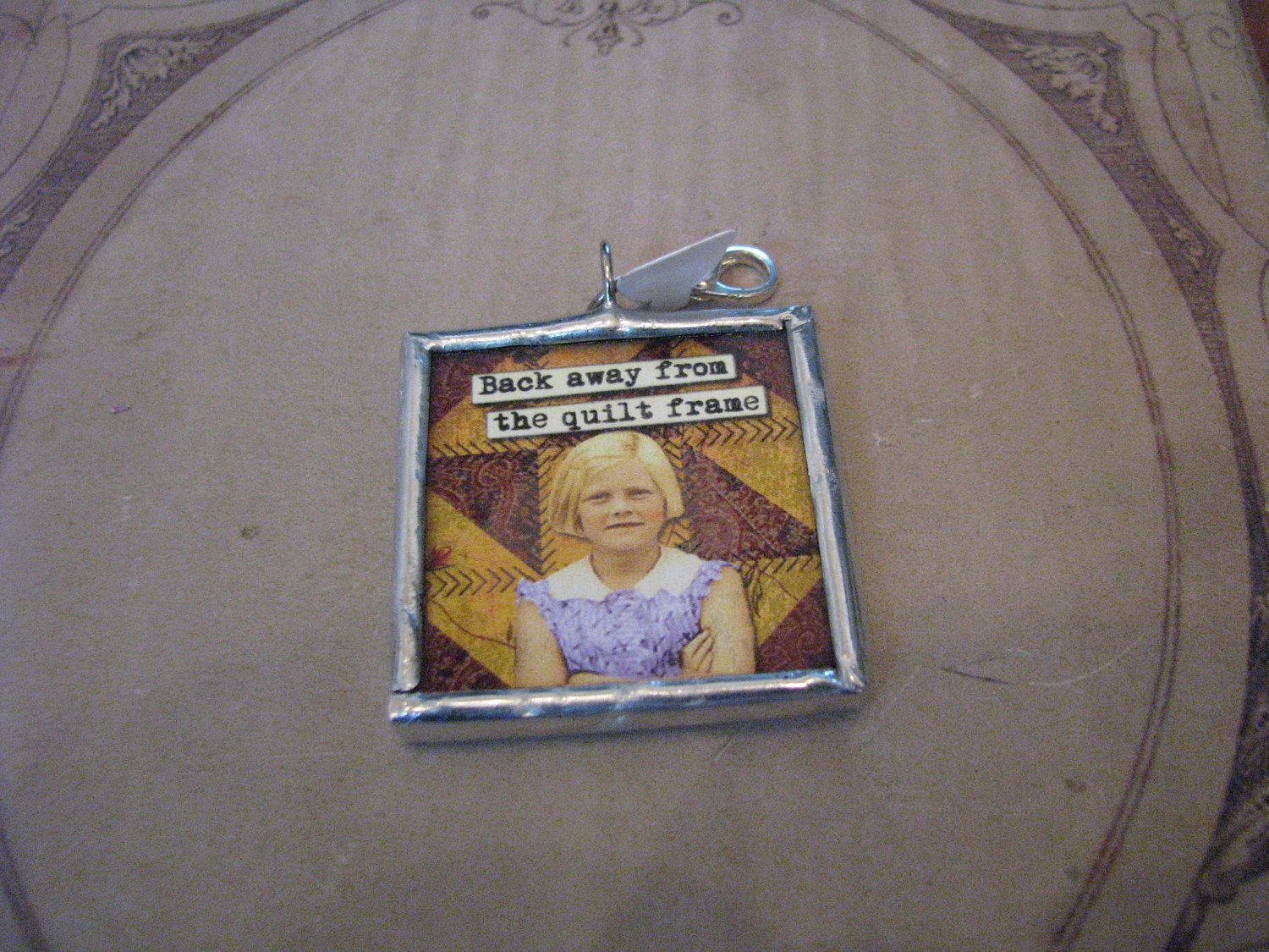 Quilt Charm back away from the quilt frame and no one gets hurt 1.5" soldered pendant