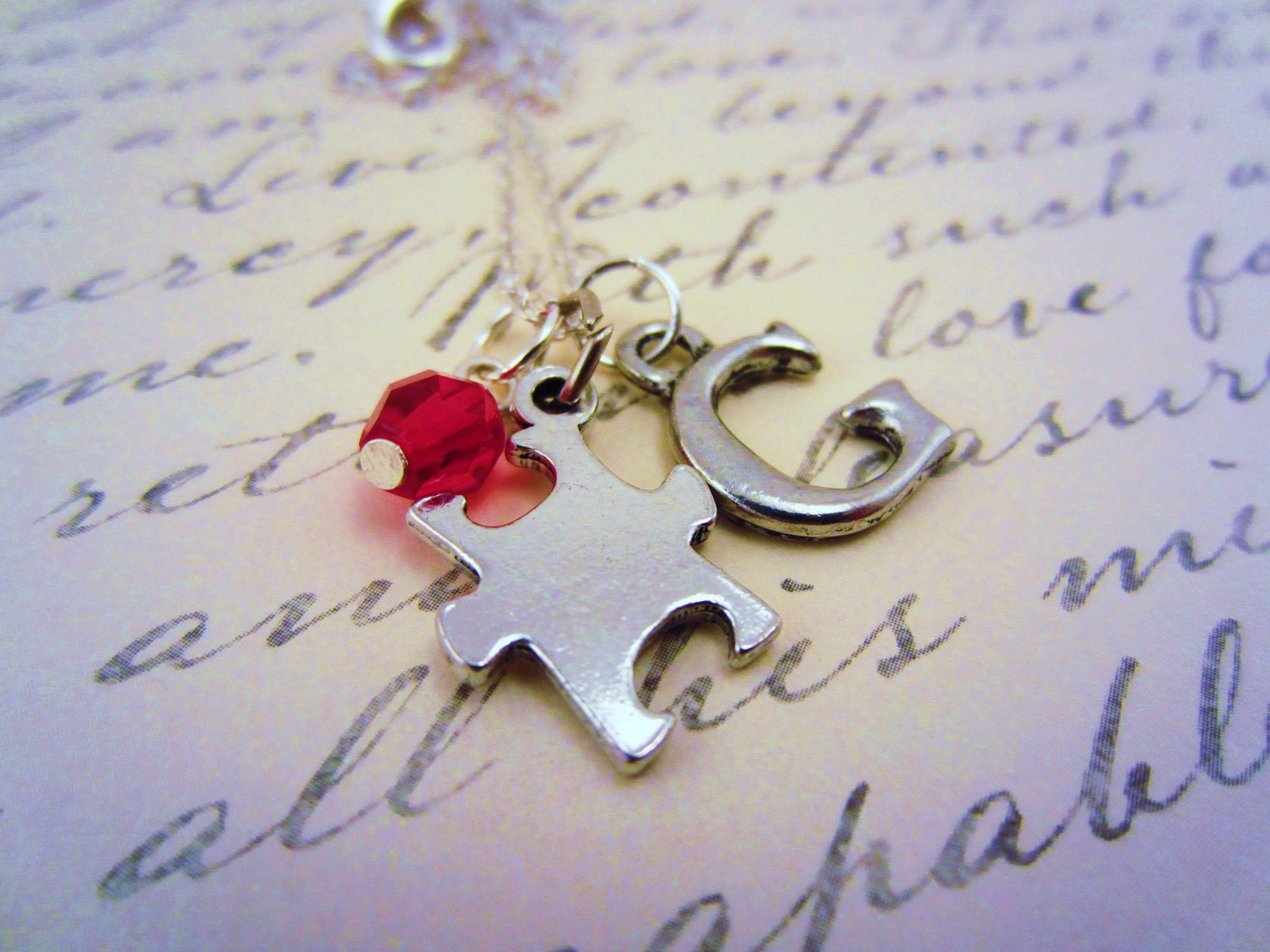Silver autism fundraiser necklace. Puzzle piece. Custom initial charm. Your choice Czech glass bead. For Easter Seals.