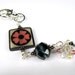 Square Funky Bone With Pink Flower Purse Charm