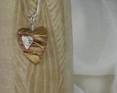heart pendant  romantic    my heart surrounds yours brass and silver.