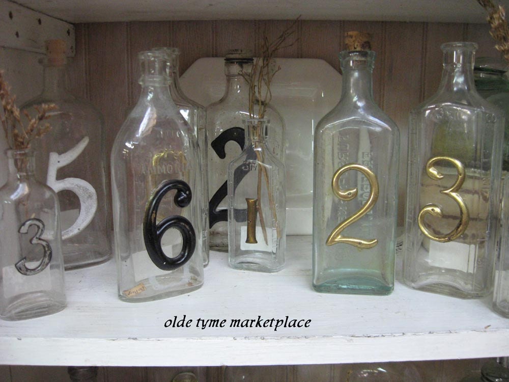 TREASURY ITEM...Vintage bottles with numbers....Set of 4