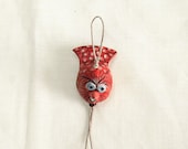 Rouge -------- Ceramic Miniature on String.
