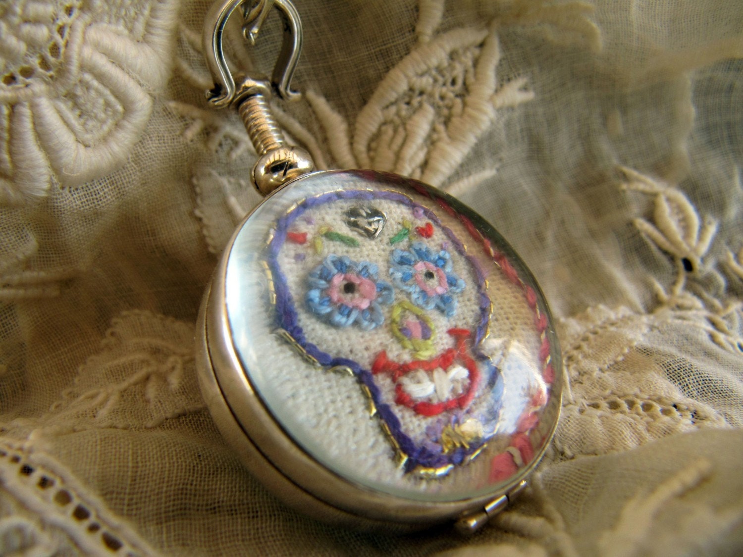 Hand Embroidered  Art Piece in a Two Sided Glass Locket , Sterling Silver Mounted Pendant