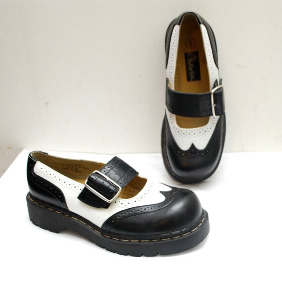 black and white spectator flats