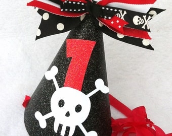 Swashbuckling pirate birthday party hat in black and red with white jollyroger skull crossbones