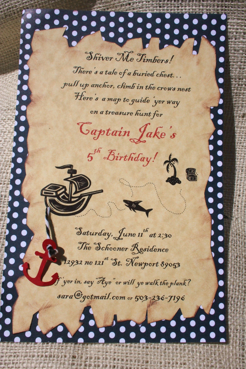 swashbuckling pirate birthday party invitation in black and red with antiqued treasure map