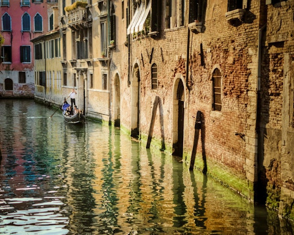 Gondola on a canal in Venice - gondolier brick walls warm pastel tones vintage muted colors wall decor romance nostalgic - Floating World