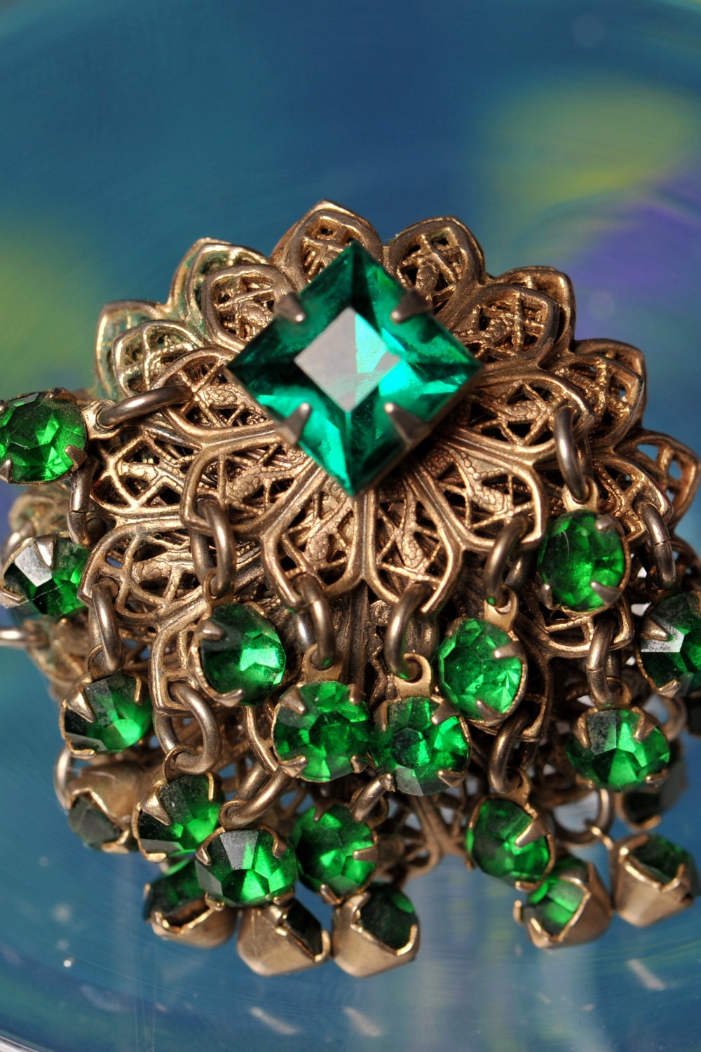 Cocktail ring.  Adjustable. Vintage. Emerald green. Movement. Gems. Metal. Repurposed.