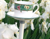 Teacup birdfeeder poke creates a charming addition to your flower garden