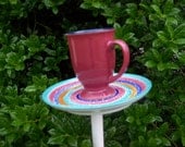 Cup and saucer birdfeeder poke