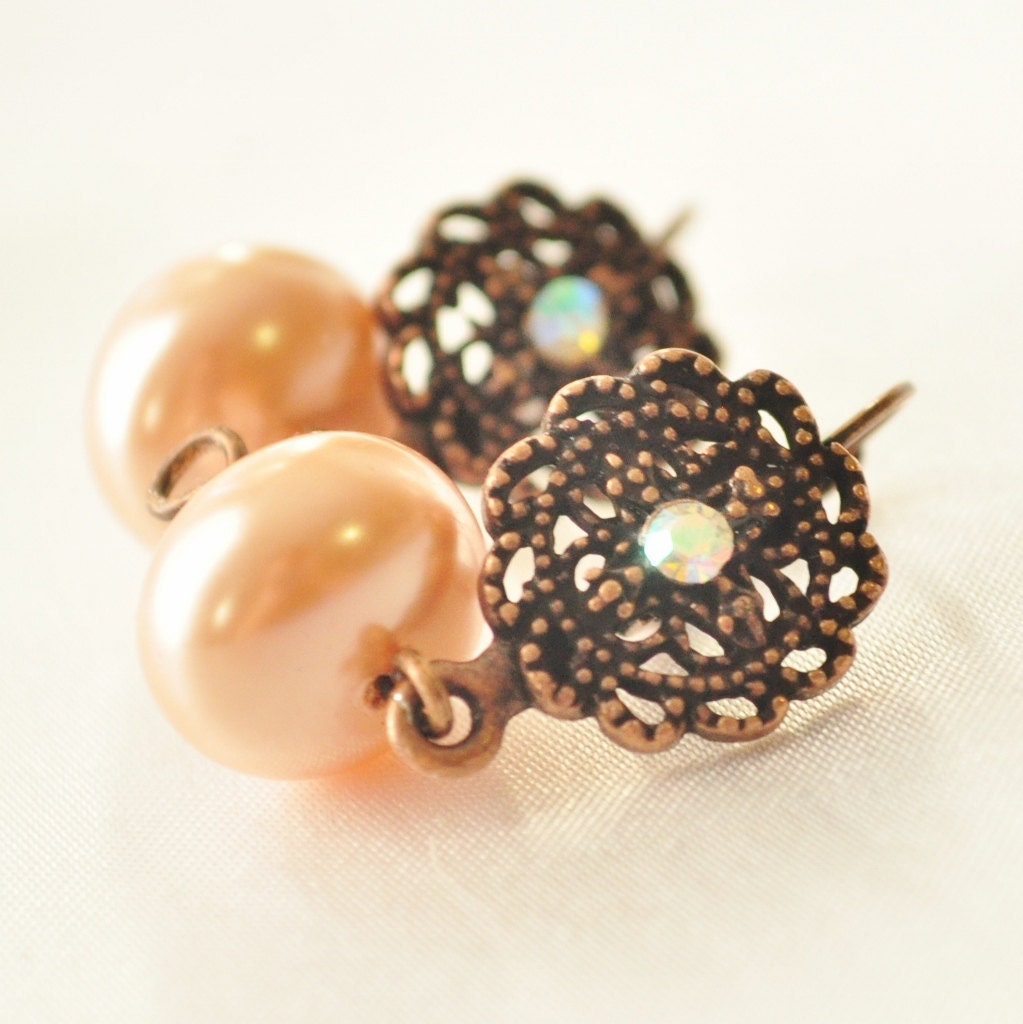 Gorgeous peach pearl dangle earrings with copper filgree and crystal embellishment