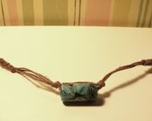 Long hemp necklace with large glass bead