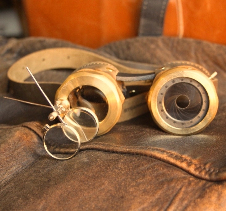 IRIS APERTURE goggles Brown and brass with one iris (left) and magnifier stem (right)