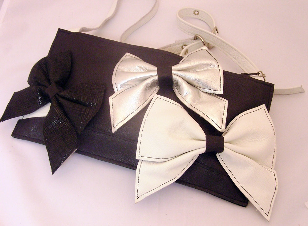 Marvelous Monday/ Black, white and silver leather handbag with a trio of bows.