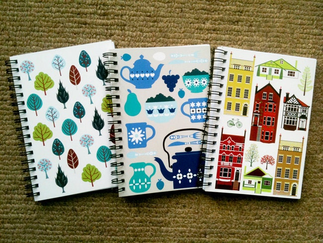 3 A6 size spiral bound notebooks with printed design on cover