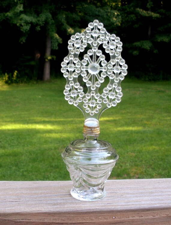 Download Vintage Perfume Bottle with Plastic Flower Top Yellowimages Mockups