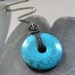 Christmas SALE 15% Turquoise Dyed Howlite Donut Sterling Silver Wire Wrapped Necklace OOAK