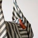 Kallia in Striped canvas and Orange leather details